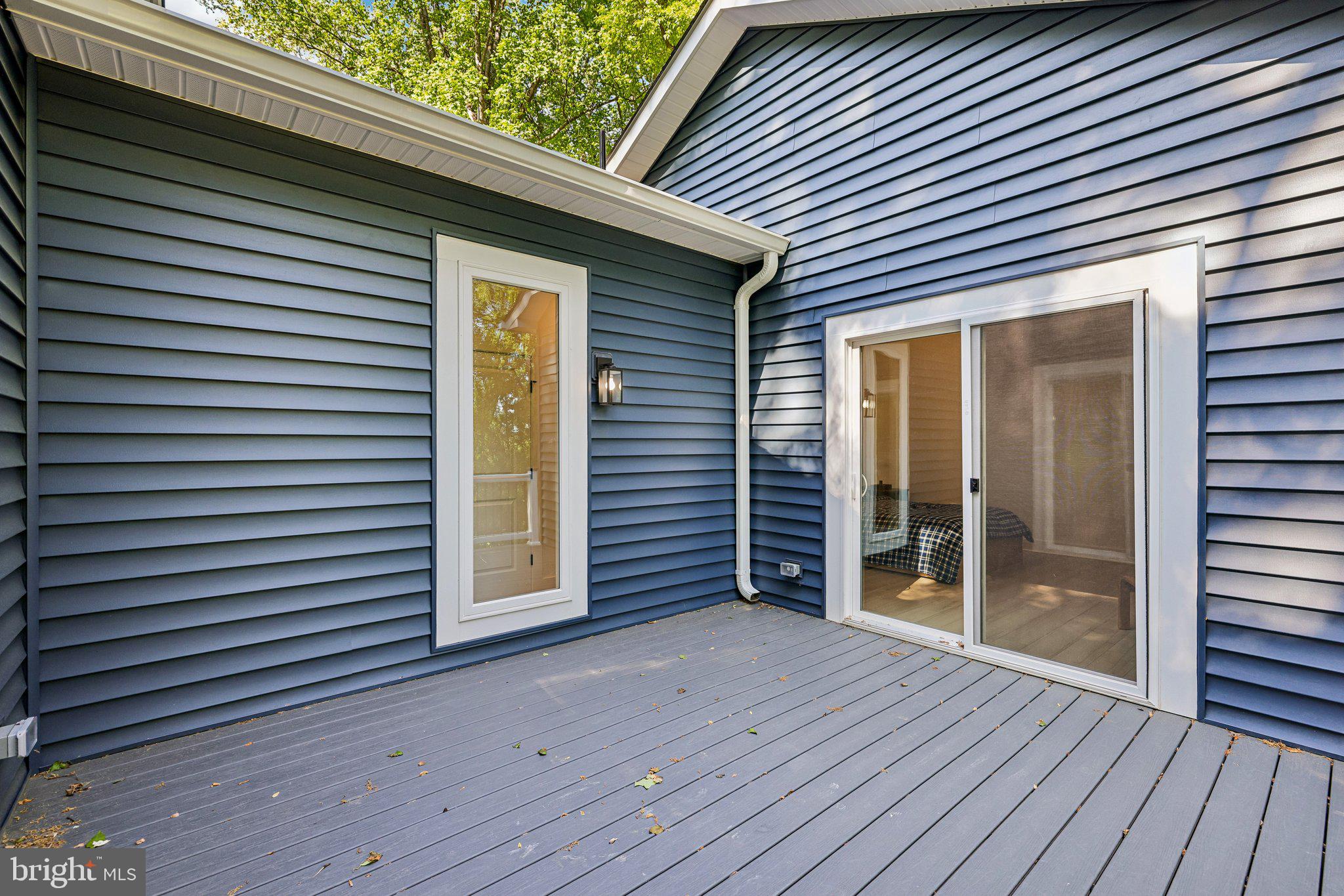 4315 Pinetree Road Rockville, MD 20853 - Photo 23 of 28 a view of a house with wooden deck