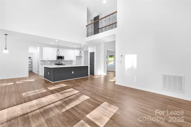 a view of a kitchen with a sink and a stove top oven