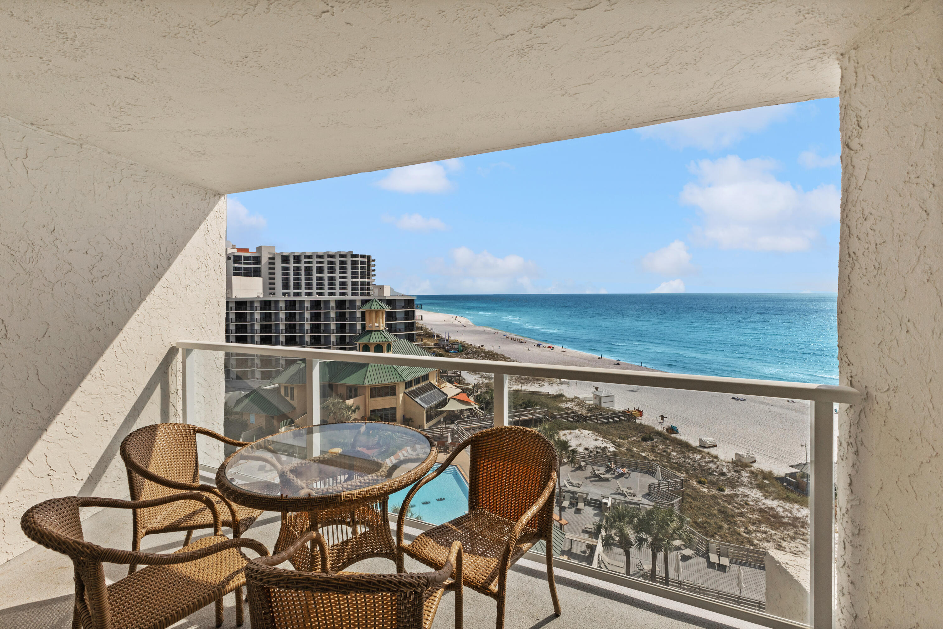 4299 Beachside 2, Unit 4299 Miramar Beach, FL 32550 - Photo 1 of 43 a balcony with table and chairs