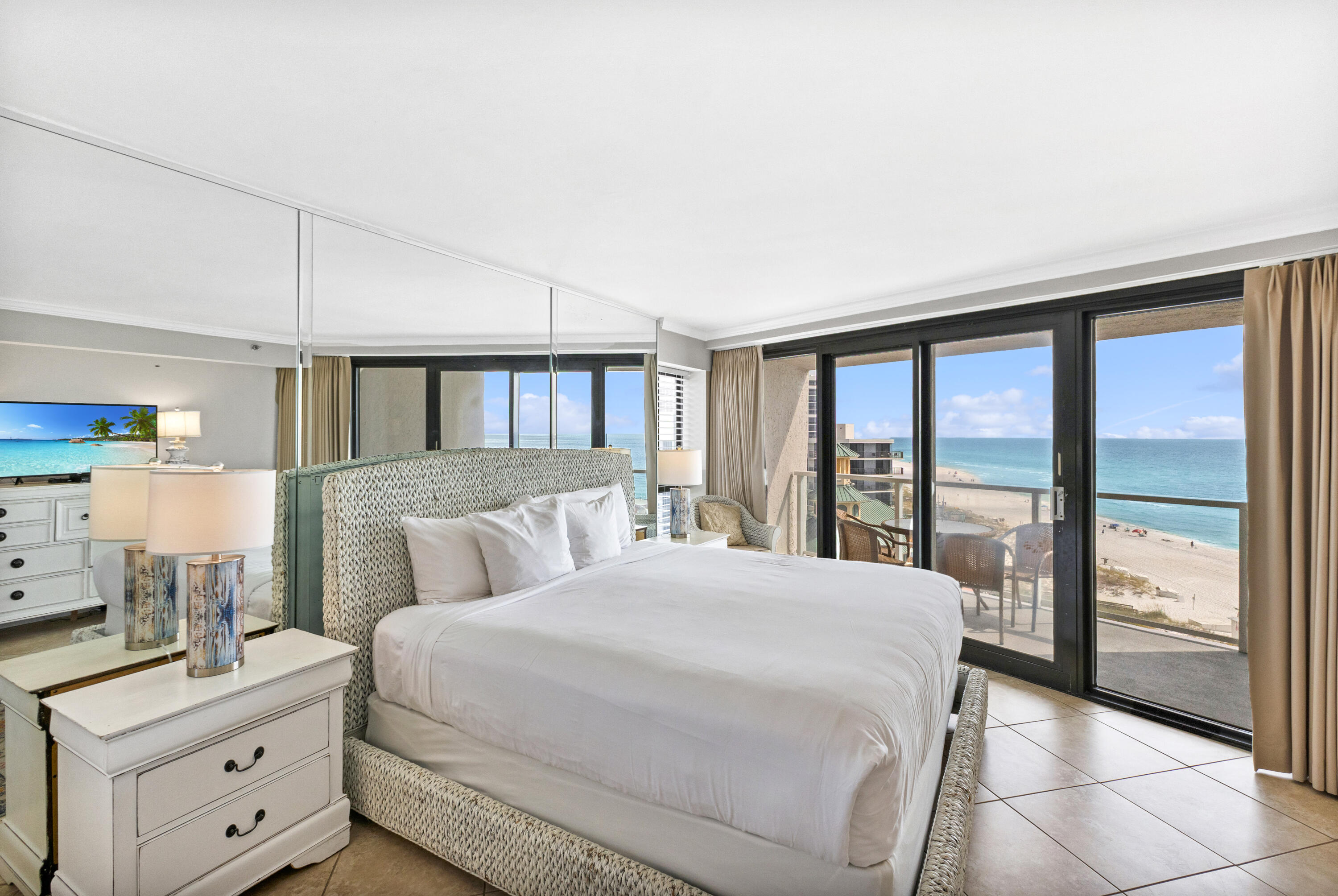 4299 Beachside 2, Unit 4299 Miramar Beach, FL 32550 - Photo 16 of 43 a bedroom with a large bed and a window