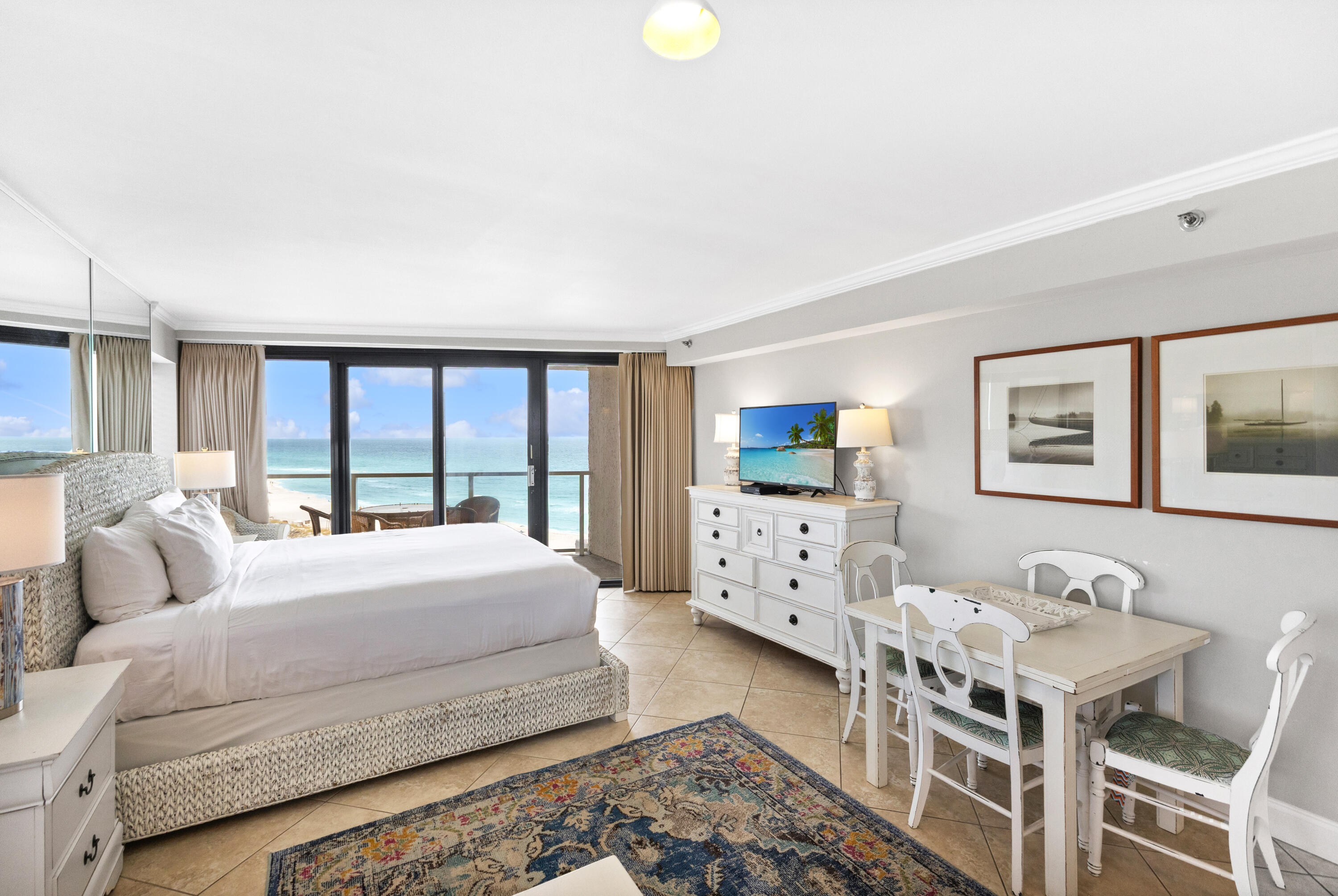 4299 Beachside 2, Unit 4299 Miramar Beach, FL 32550 - Photo 17 of 43 a bedroom with a bed window and table