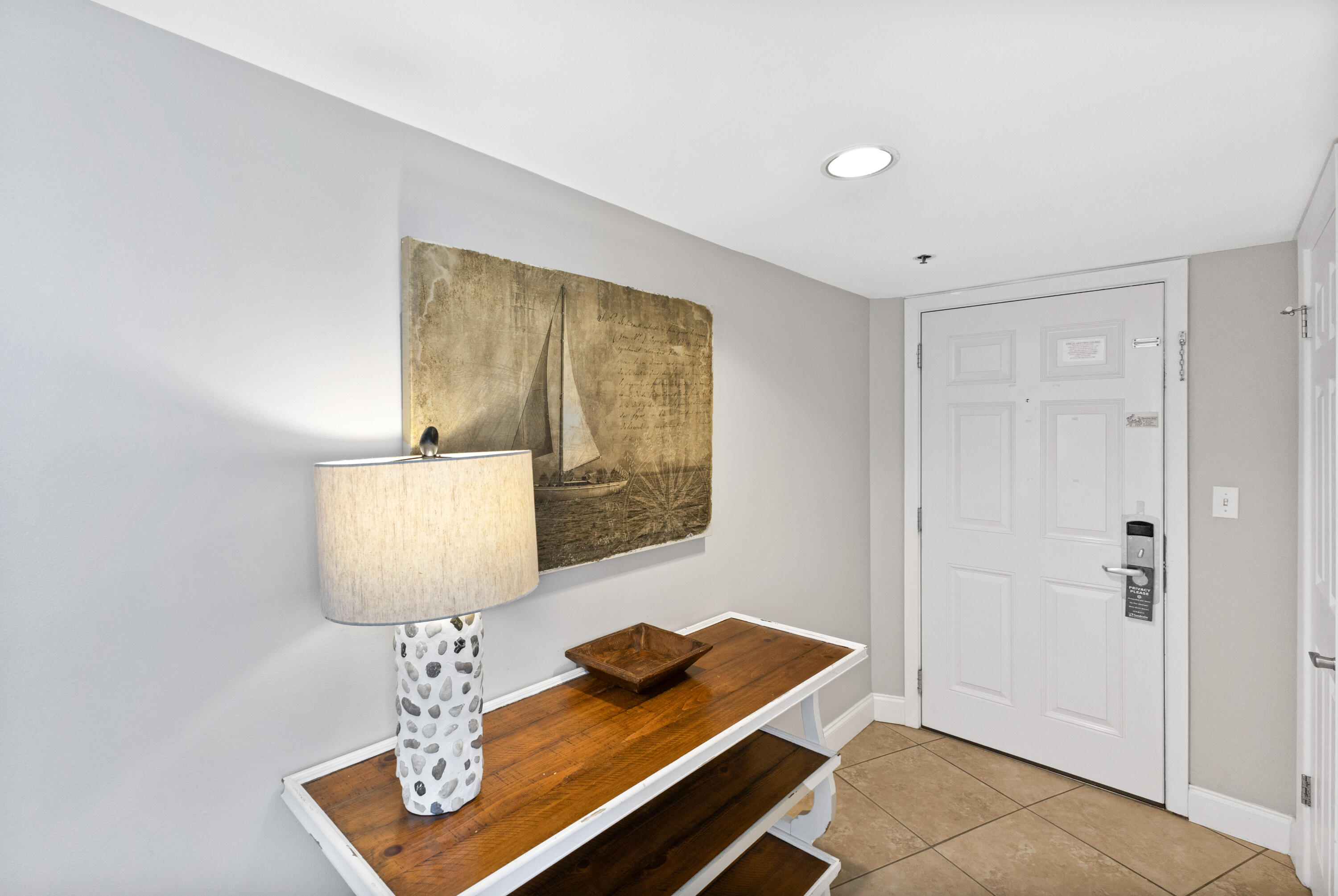 4299 Beachside 2, Unit 4299 Miramar Beach, FL 32550 - Photo 7 of 43 a room with table lamp and mirror