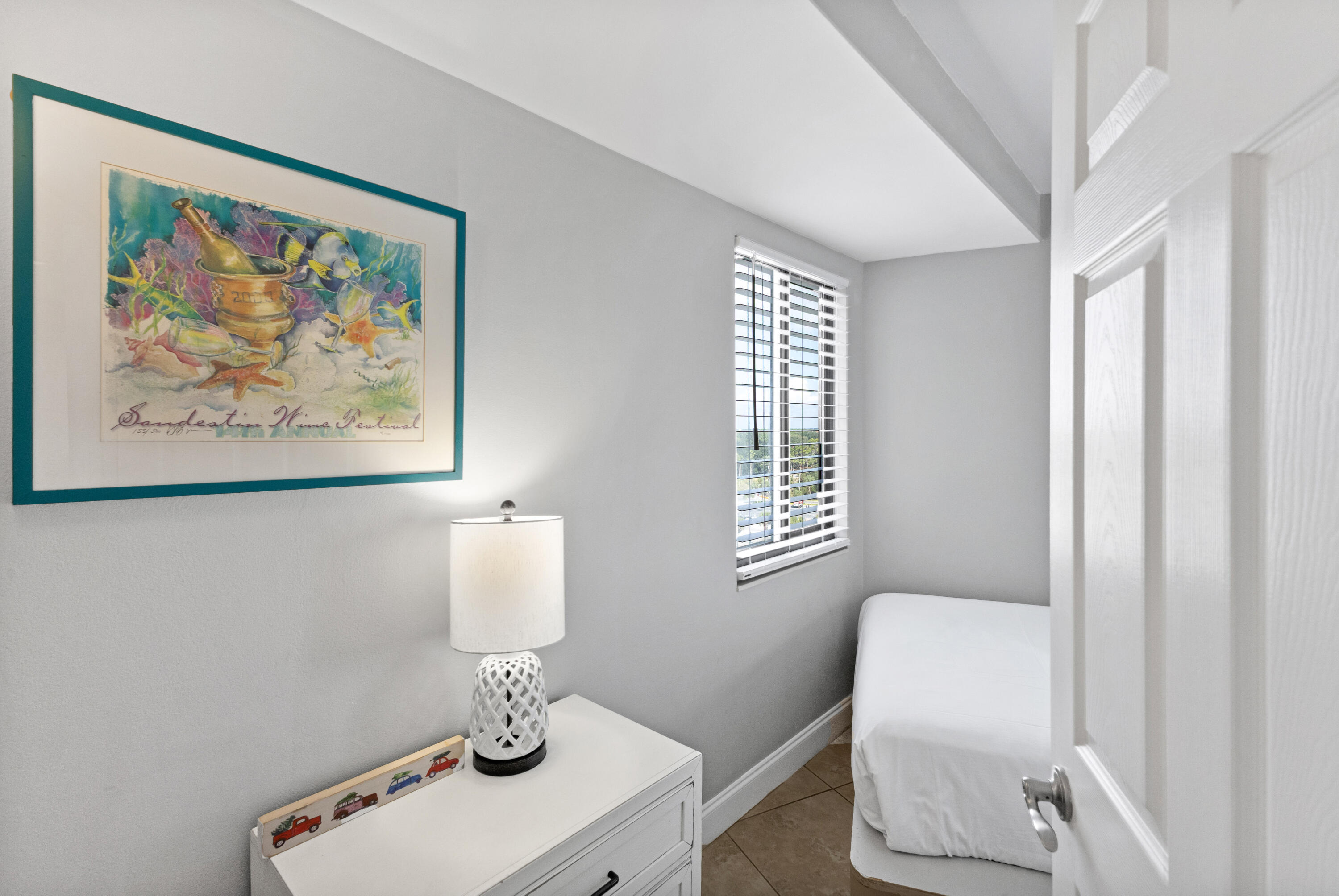 4299 Beachside 2, Unit 4299 Miramar Beach, FL 32550 - Photo 8 of 43 a bathroom with a toilet a sink and a window