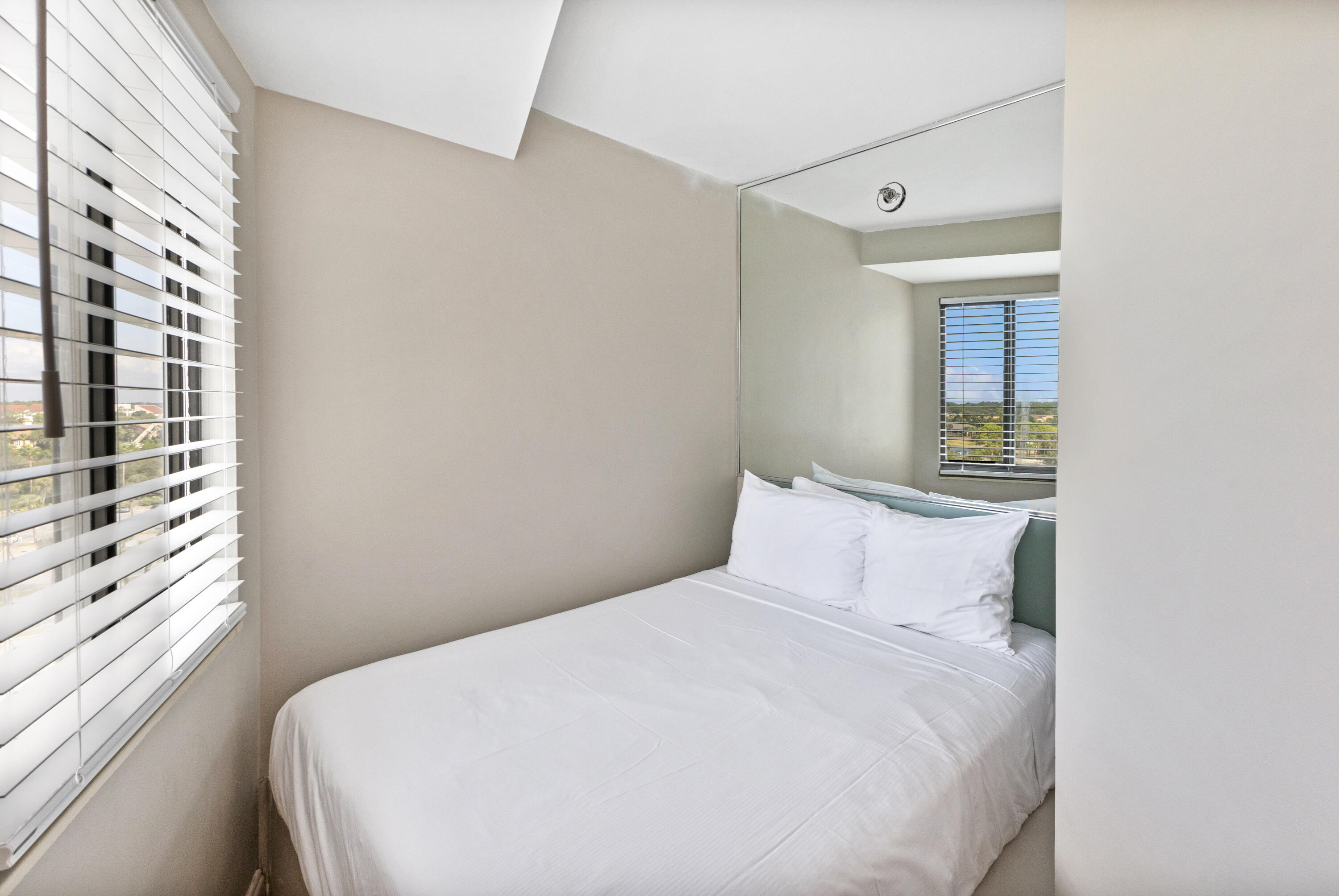 4299 Beachside 2, Unit 4299 Miramar Beach, FL 32550 - Photo 9 of 43 a bedroom with a bed and a window