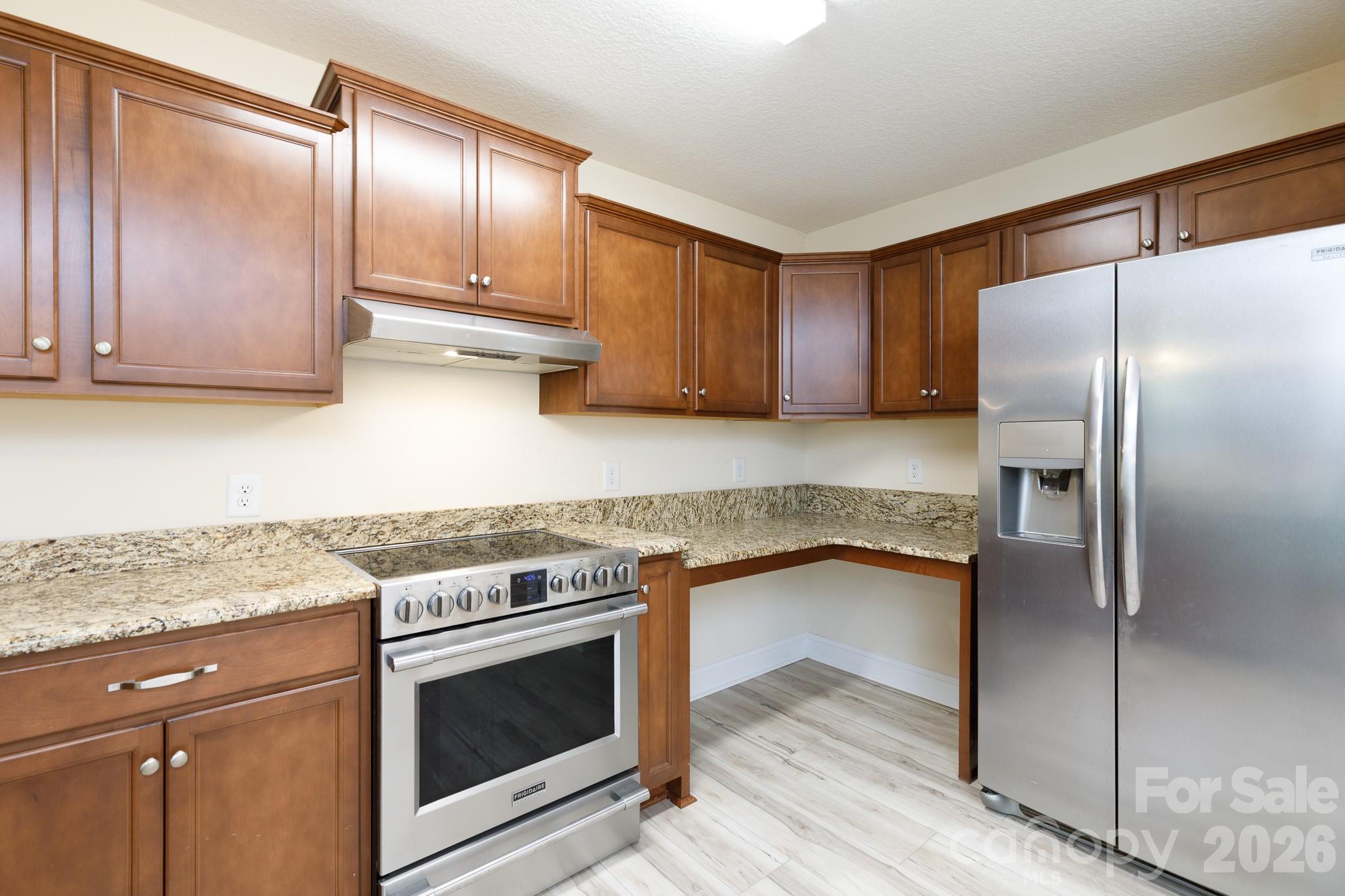 3692 Armstrong Ford Road Rock Hill, SC 29730 - Photo 11 of 30 a kitchen with a refrigerator sink and cabinets
