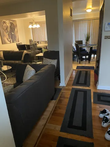 a living room with furniture and a table