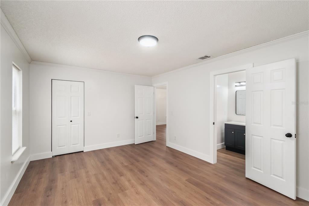 7670 Southwest 80th Place Ocala, FL 34476 - Photo 18 of 44 a view of a livingroom with wooden floor and closet