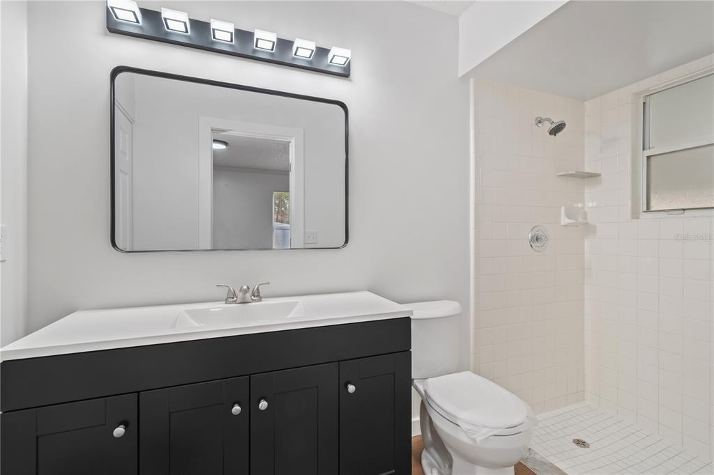 7670 Southwest 80th Place Ocala, FL 34476 - Photo 20 of 44 a bathroom with a toilet sink and mirror