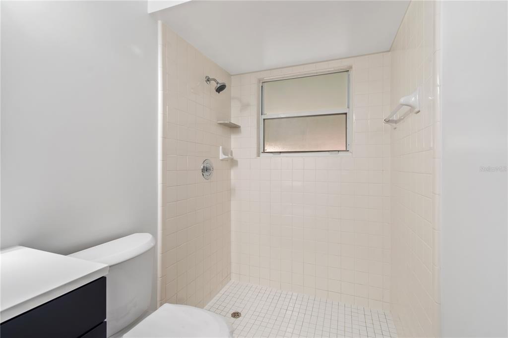 7670 Southwest 80th Place Ocala, FL 34476 - Photo 21 of 44 a bathroom with a toilet and a shower