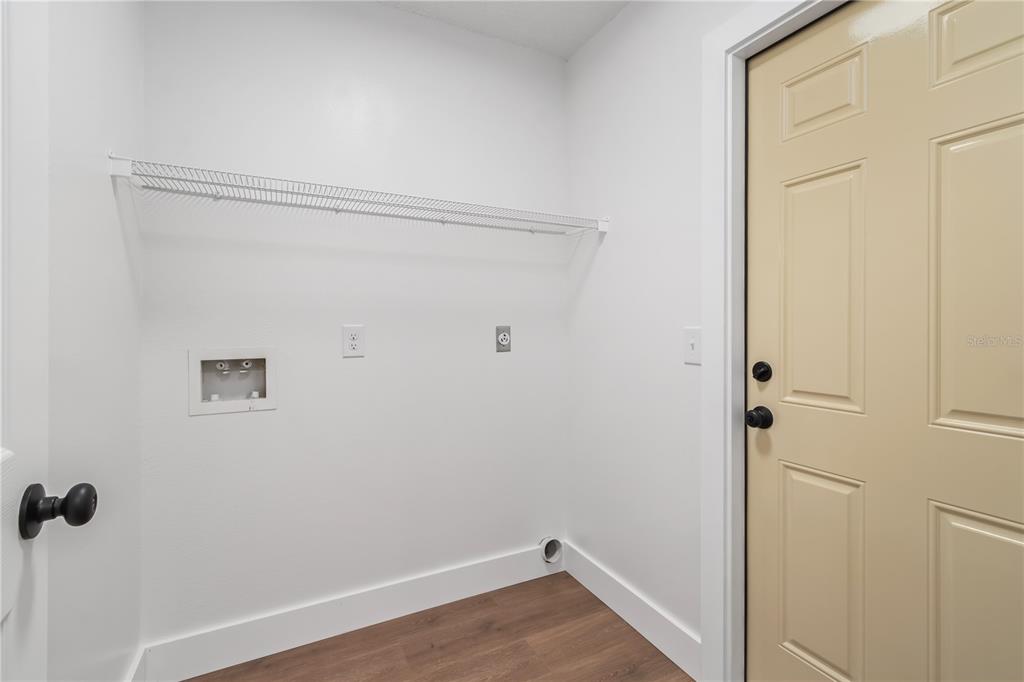 7670 Southwest 80th Place Ocala, FL 34476 - Photo 43 of 44 a view of a room with wooden floor