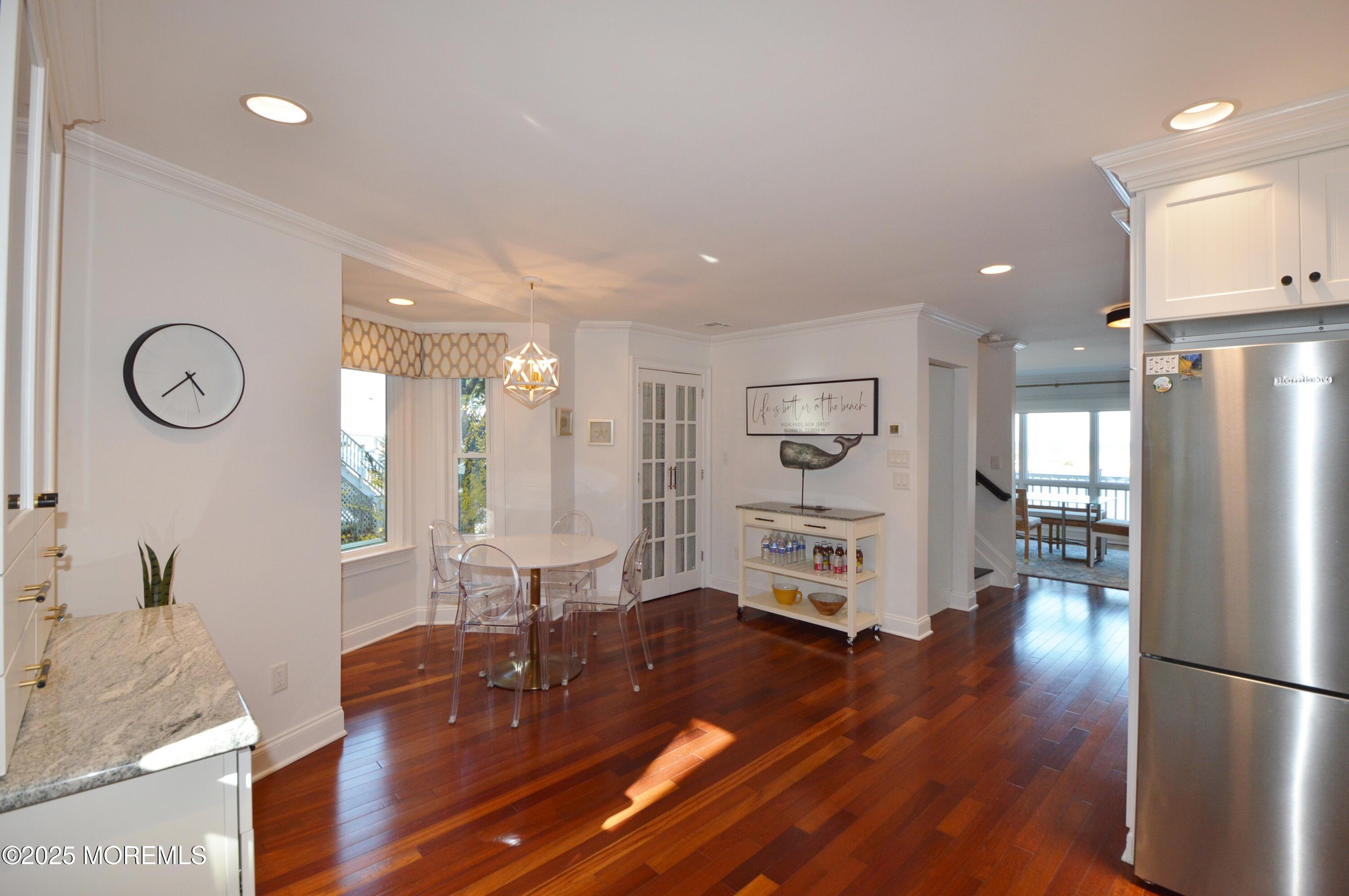 200 Portland Road, Unit A25 Highlands, NJ 07732 - Photo 33 of 59 a living room with furniture a large window and wooden floor