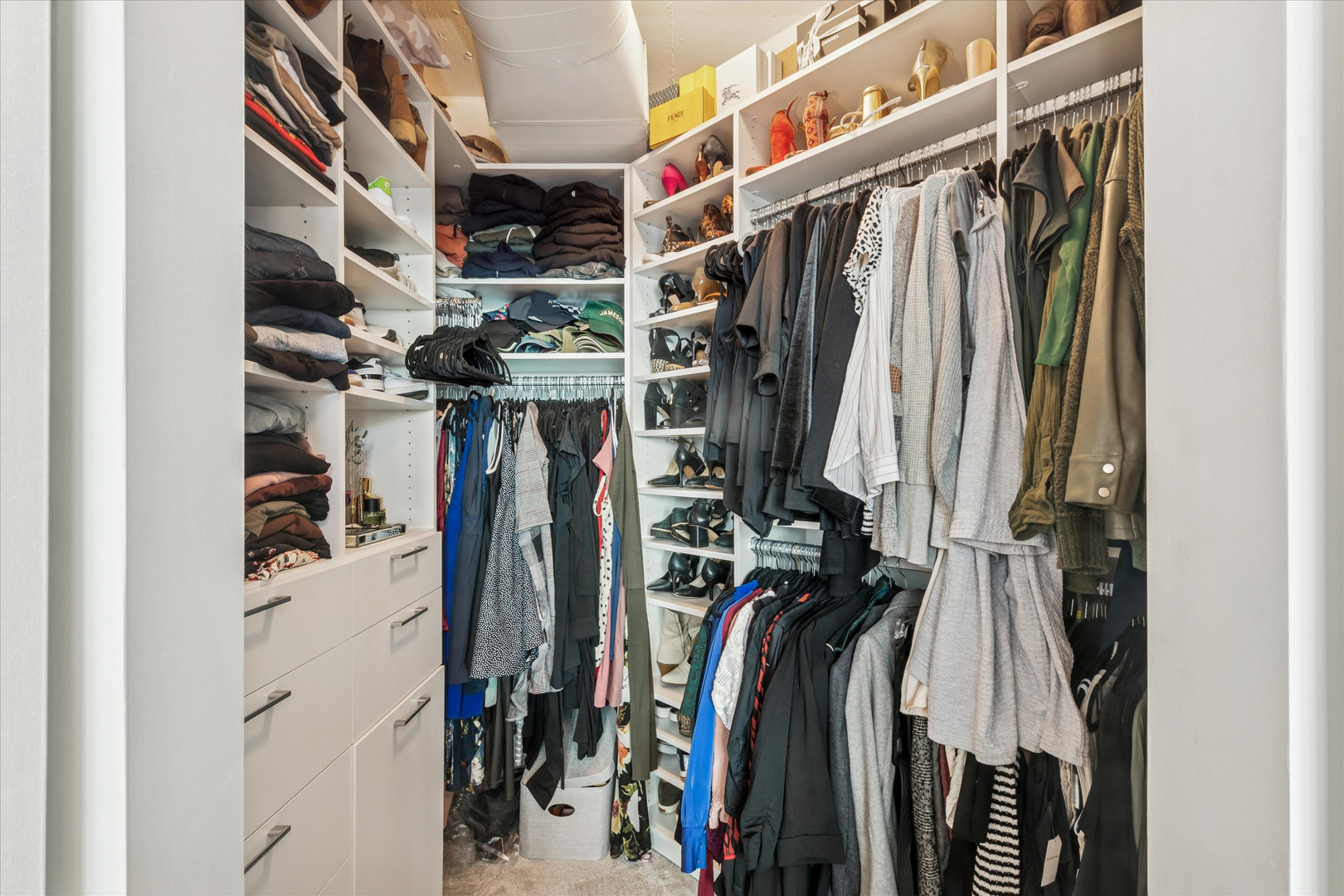 909 West Washington Boulevard, Unit 508 Chicago, IL 60607 - Photo 14 of 20 a view of walk in closet with clothes and shoes