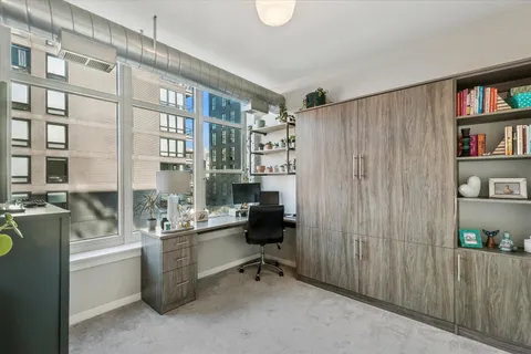 a room with a book shelf and a bookshelf