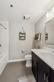 a bathroom with a sink a toilet and vanity