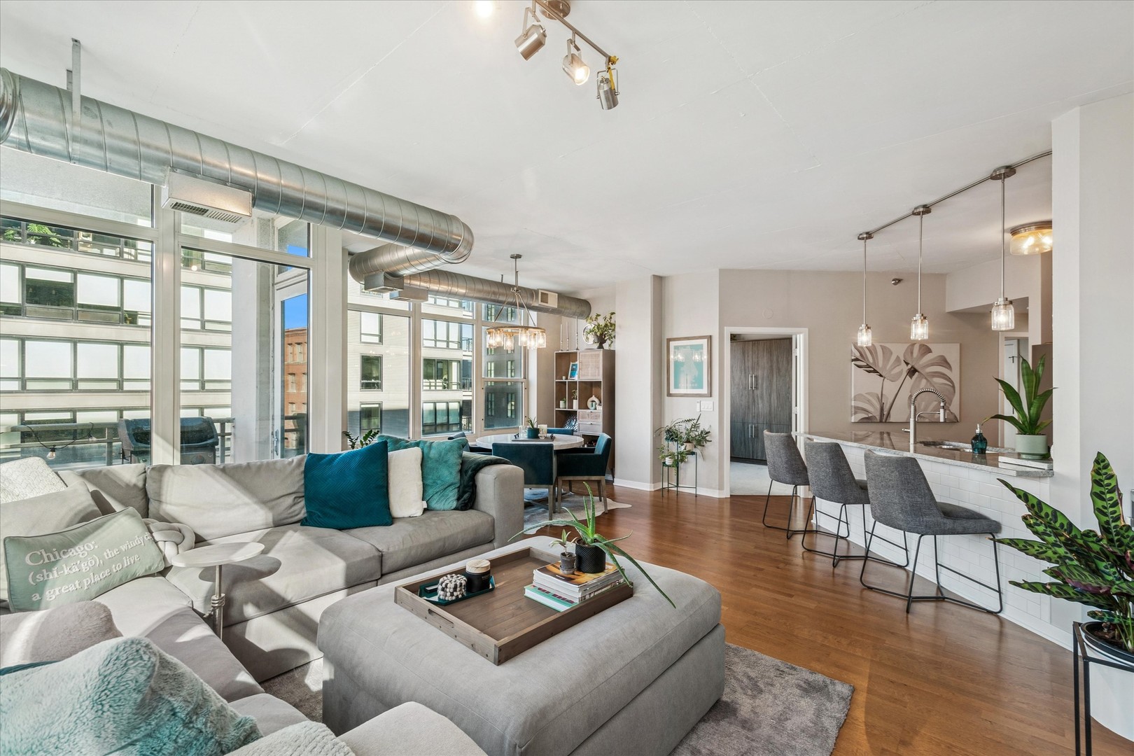 909 West Washington Boulevard, Unit 508 Chicago, IL 60607 - Photo 4 of 20 a living room with furniture and floor to ceiling windows