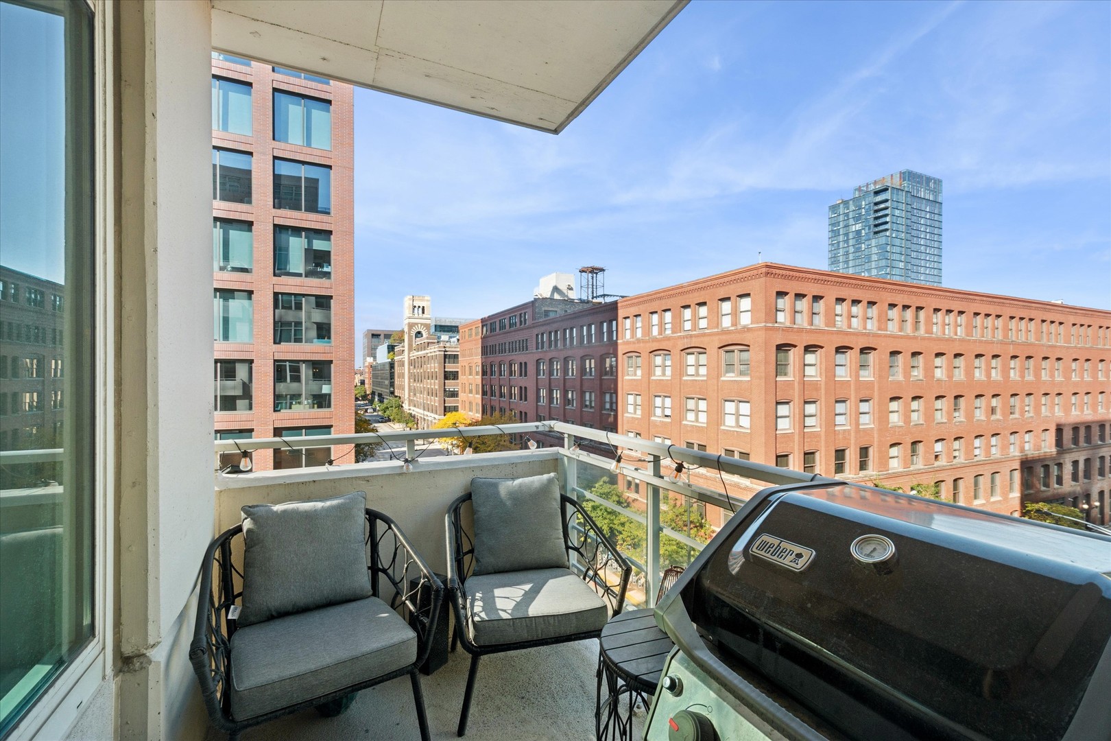 909 West Washington Boulevard, Unit 508 Chicago, IL 60607 - Photo 10 of 20 a view of a balcony with chairs