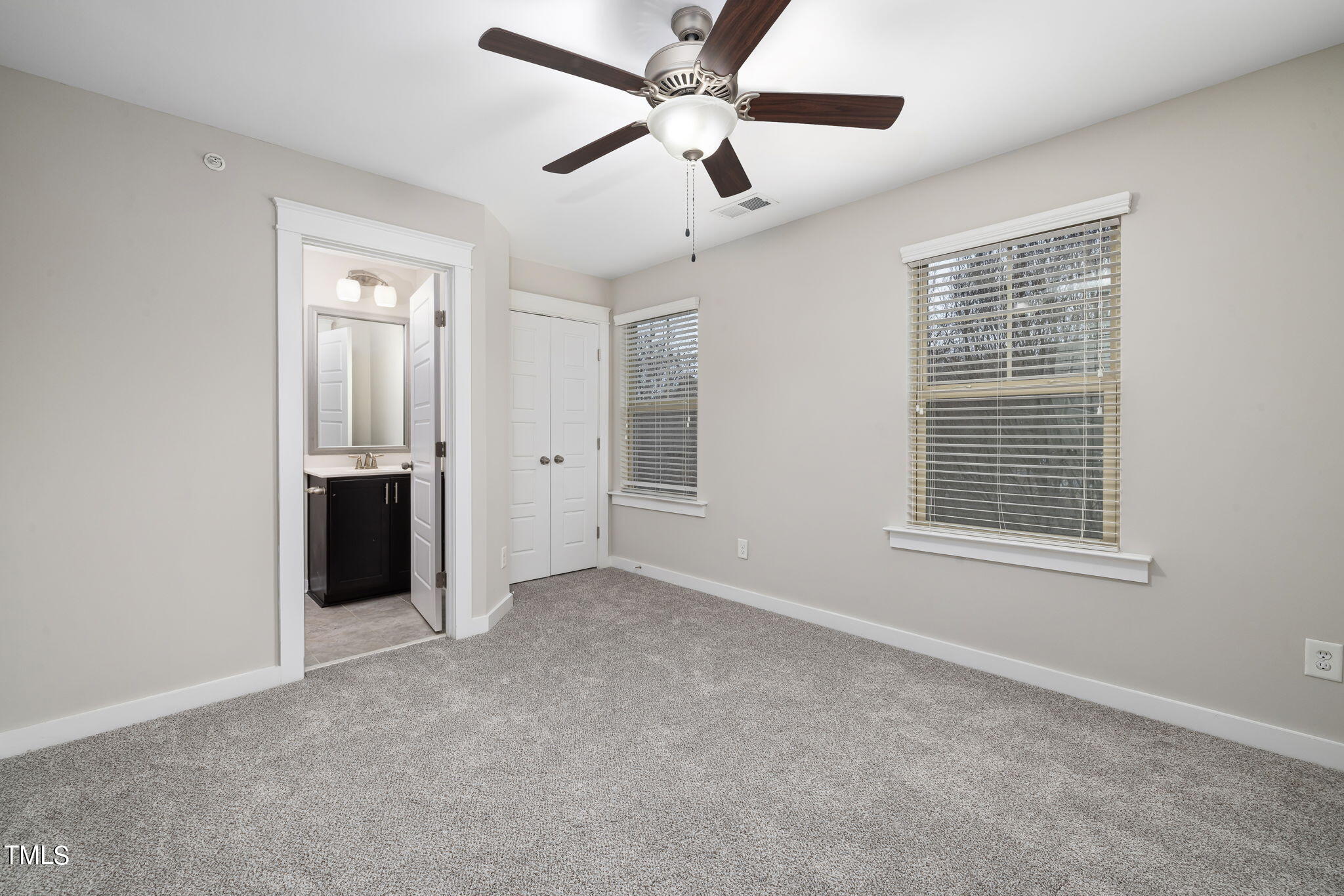 7800 Allscott Way Raleigh, NC 27612 - Photo 16 of 29 a view of an empty room with a ceiling fan and a window