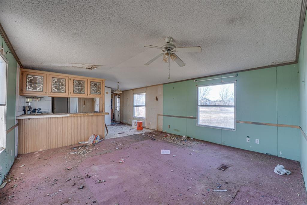 100 Zodiac Strait Road Ferris, TX 75125 - Photo 4 of 19 a view of an empty room with a window