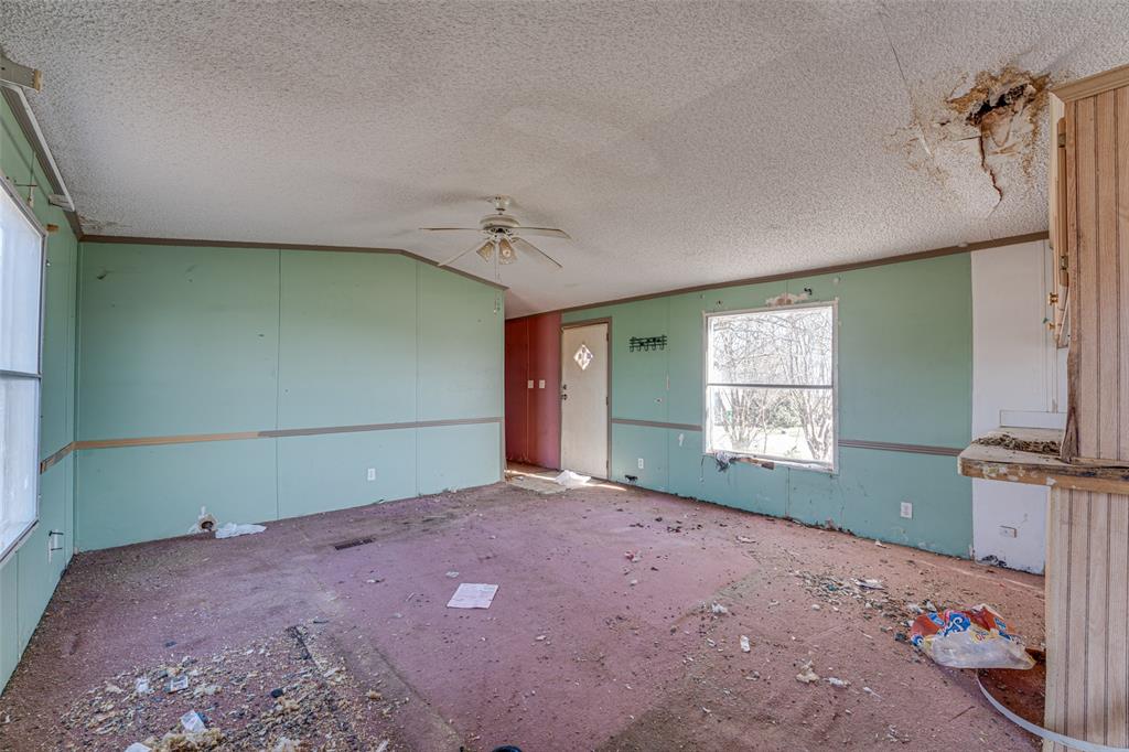 100 Zodiac Strait Road Ferris, TX 75125 - Photo 5 of 19 an empty room with windows and closet