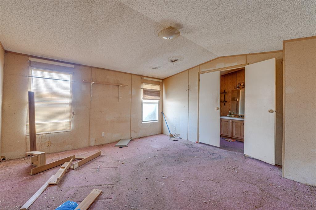 100 Zodiac Strait Road Ferris, TX 75125 - Photo 9 of 19 an empty room with windows and closet