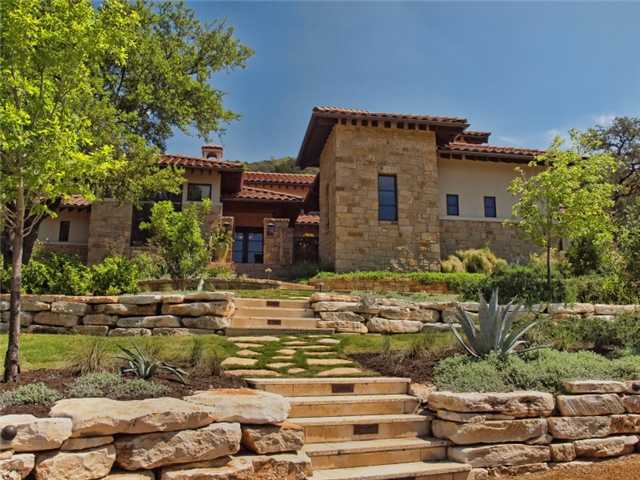 620 Logans Lane Austin, TX 78746 - Photo 1 of 1 a front view of a house with garden