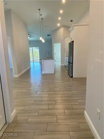 a view of a hallway with a chandelier