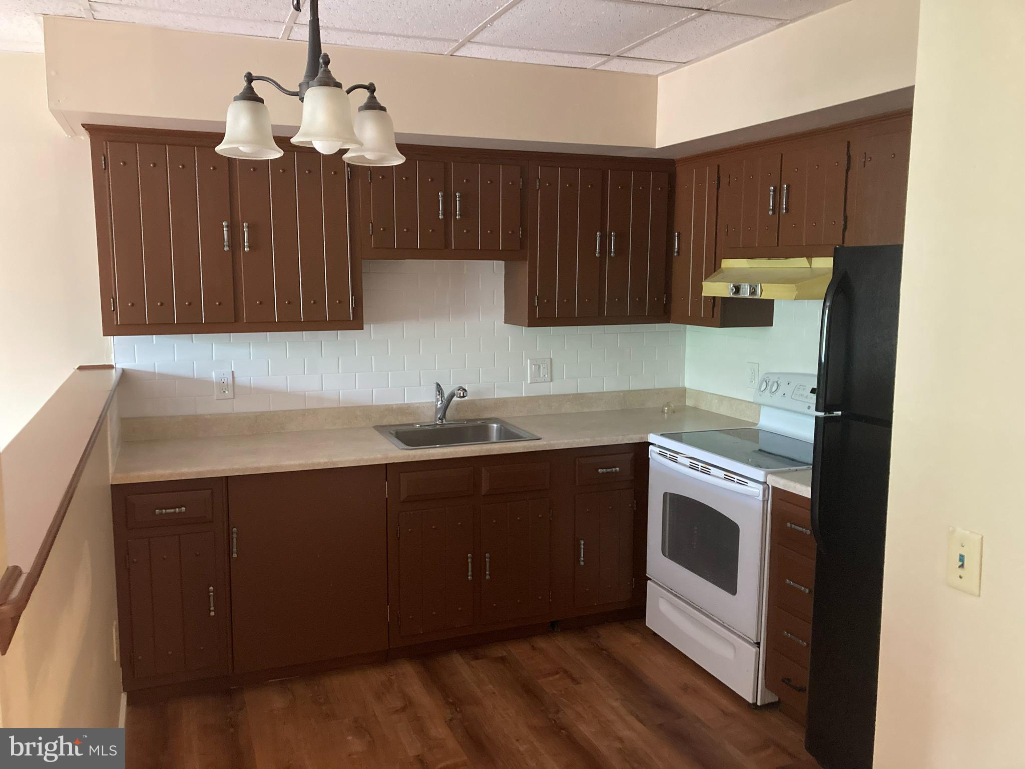 102 Delaware Road, Unit 2 Riegelsville, PA 18077 - Photo 5 of 9 a kitchen with granite countertop a sink cabinets and stainless steel appliances