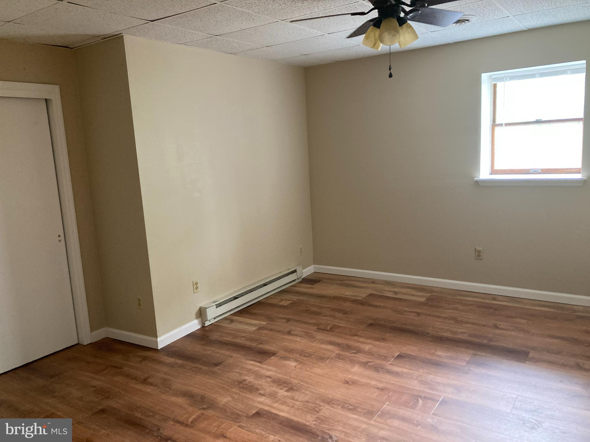 102 Delaware Road, Unit 2 Riegelsville, PA 18077 - Photo 6 of 9 a view of an empty room with a window