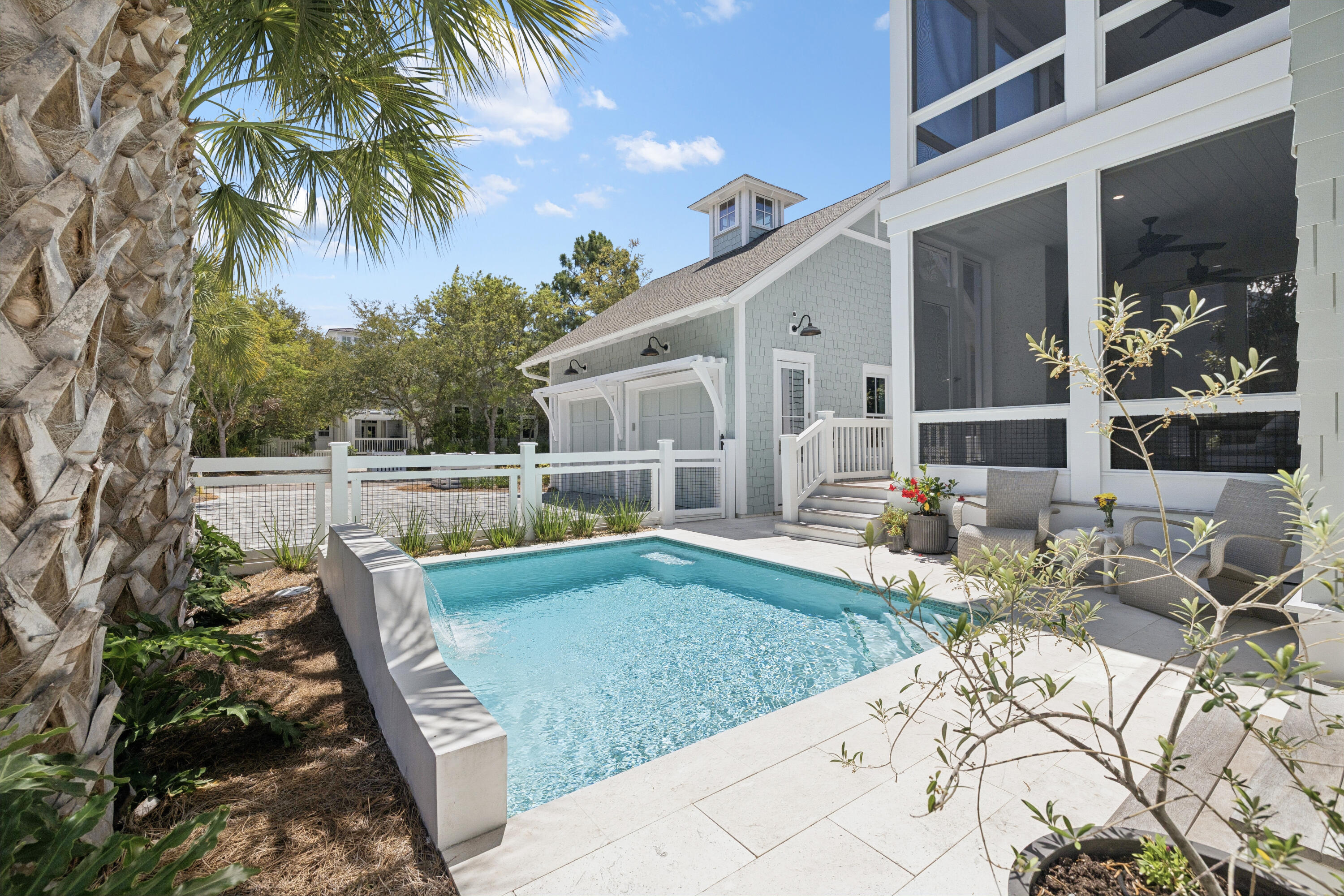 41 North Shingle Lane Watersound, FL 32461 - Photo 1 of 48 a view of a house with backyard sitting area and swimming pool