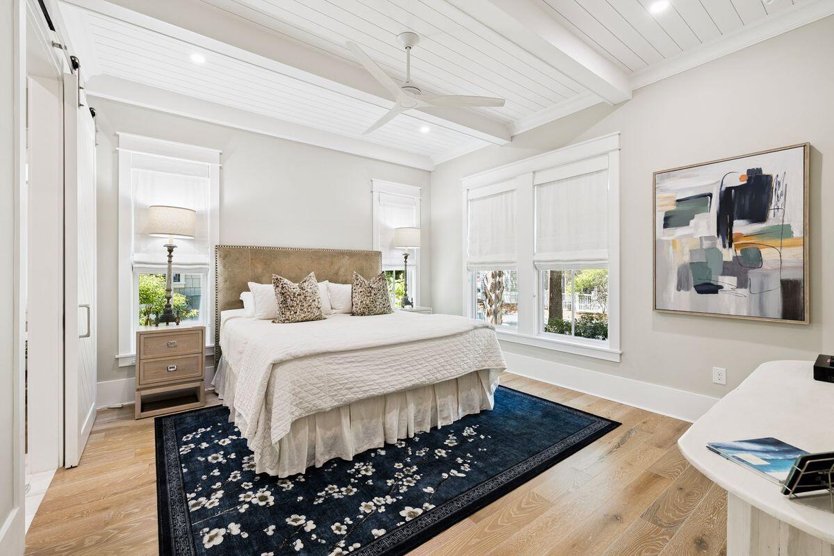 41 North Shingle Lane Watersound, FL 32461 - Photo 13 of 48 a bedroom with a large bed and a window