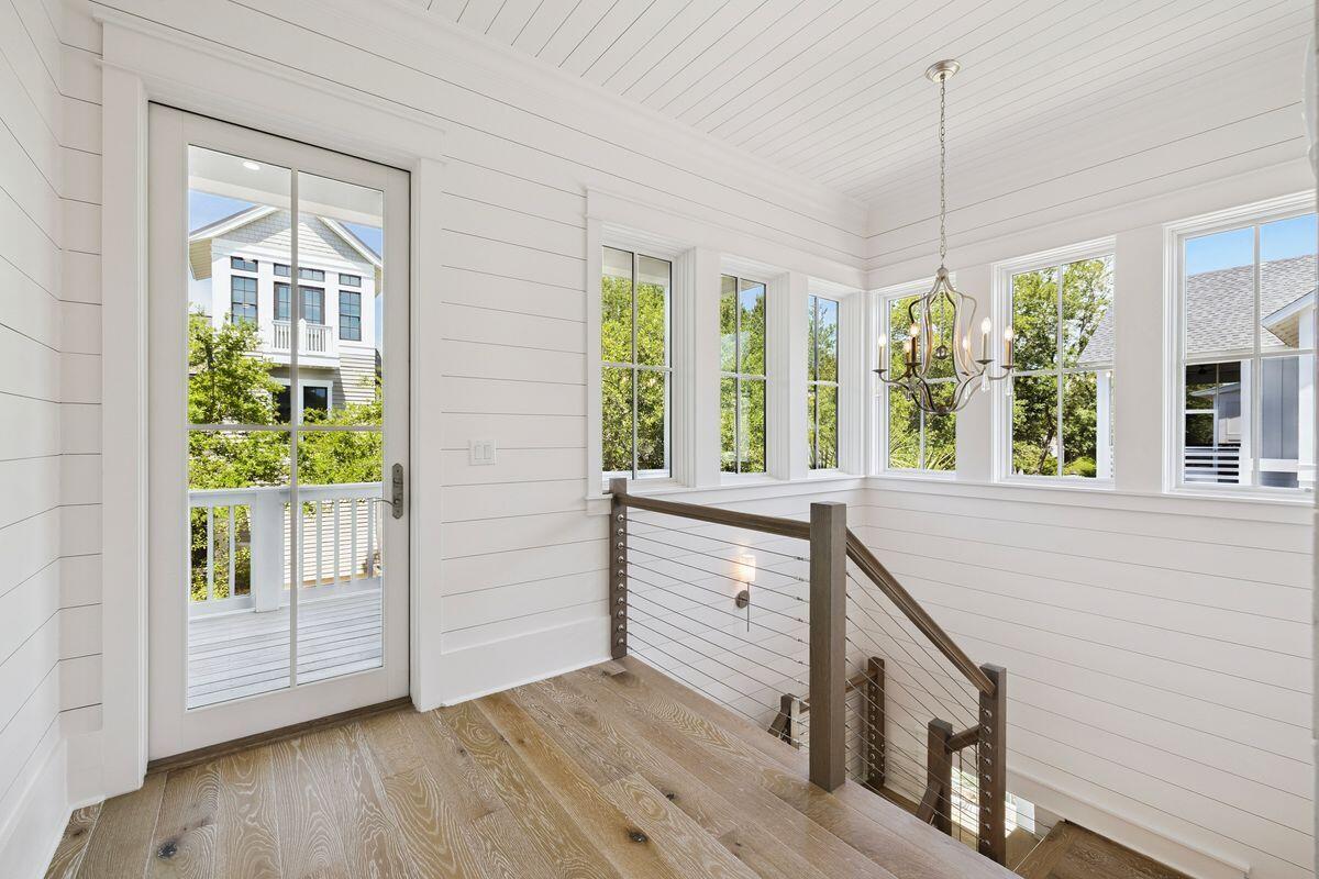 41 North Shingle Lane Watersound, FL 32461 - Photo 17 of 48 a view of an entryway with wooden floor and windows