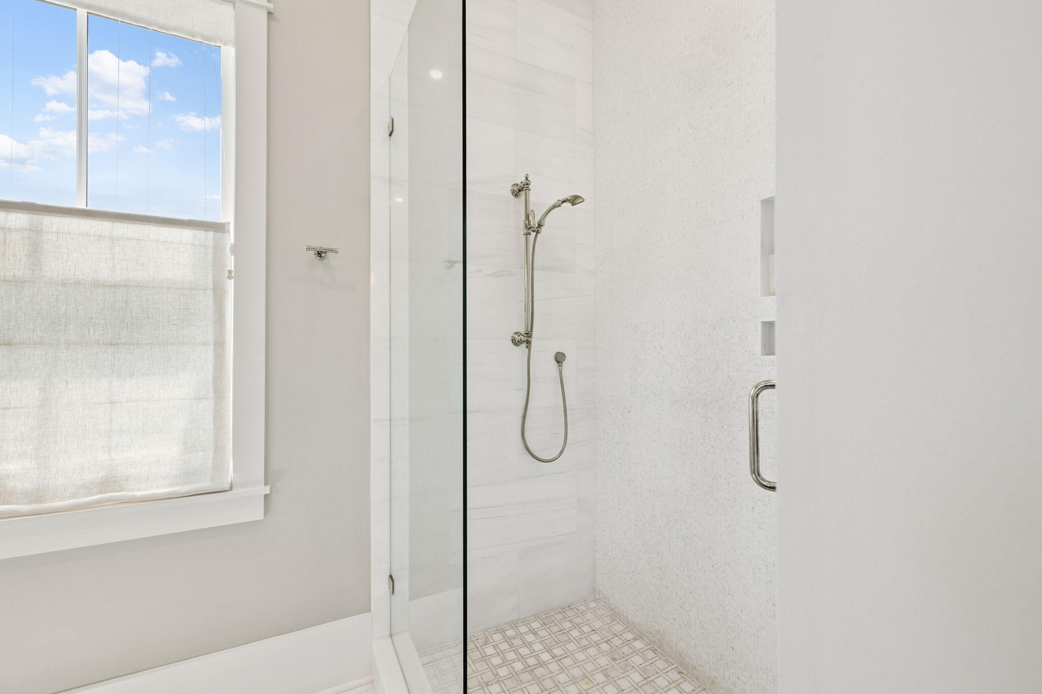 41 North Shingle Lane Watersound, FL 32461 - Photo 22 of 48 a bathroom with a glass shower door