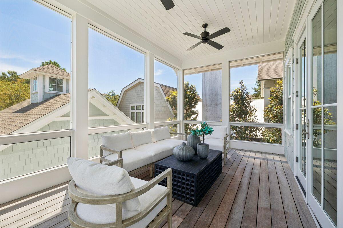 41 North Shingle Lane Watersound, FL 32461 - Photo 25 of 48 a living room with couches a coffee table and a chandelier with wooden floor