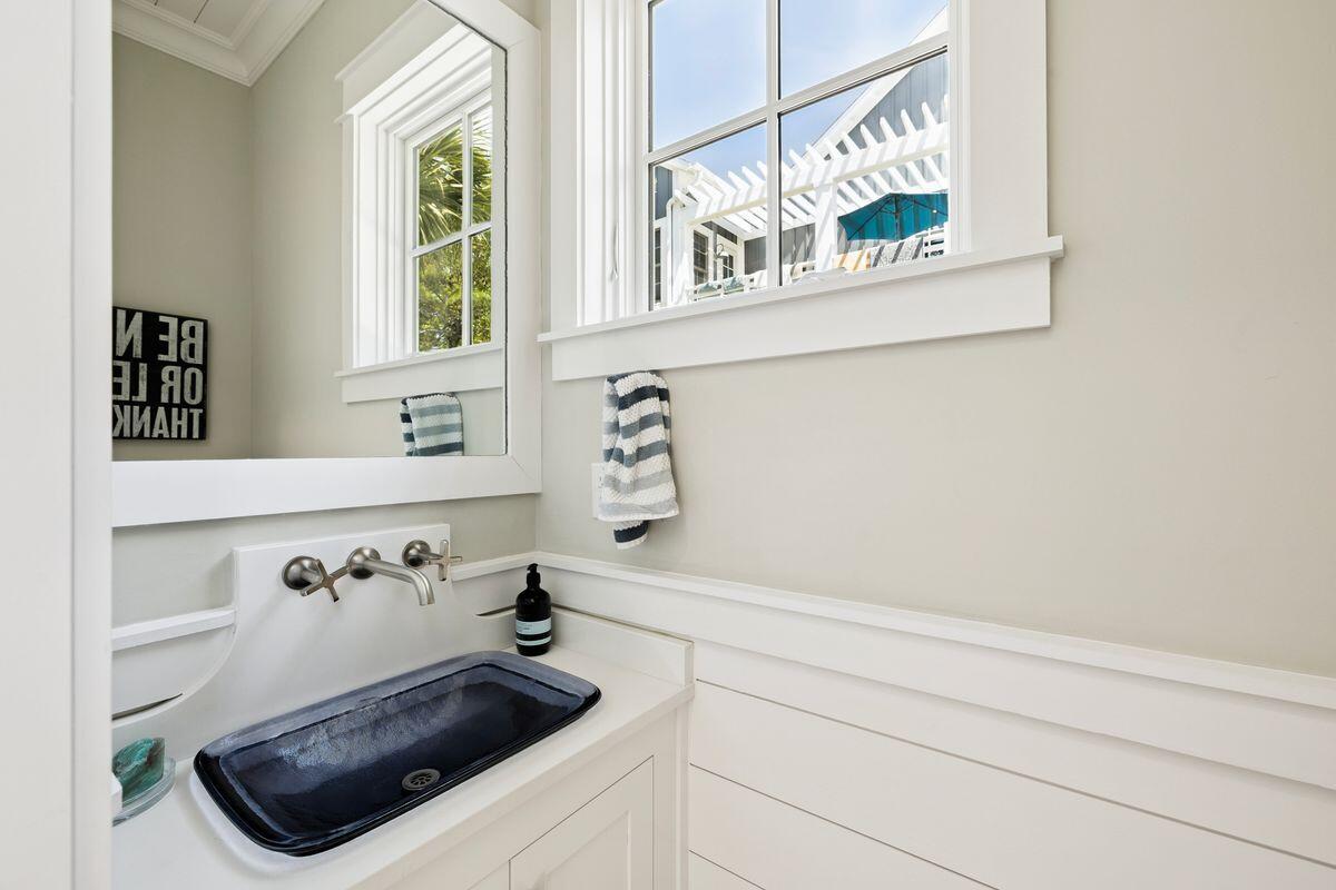 41 North Shingle Lane Watersound, FL 32461 - Photo 36 of 48 a bathroom with a sink and a mirror