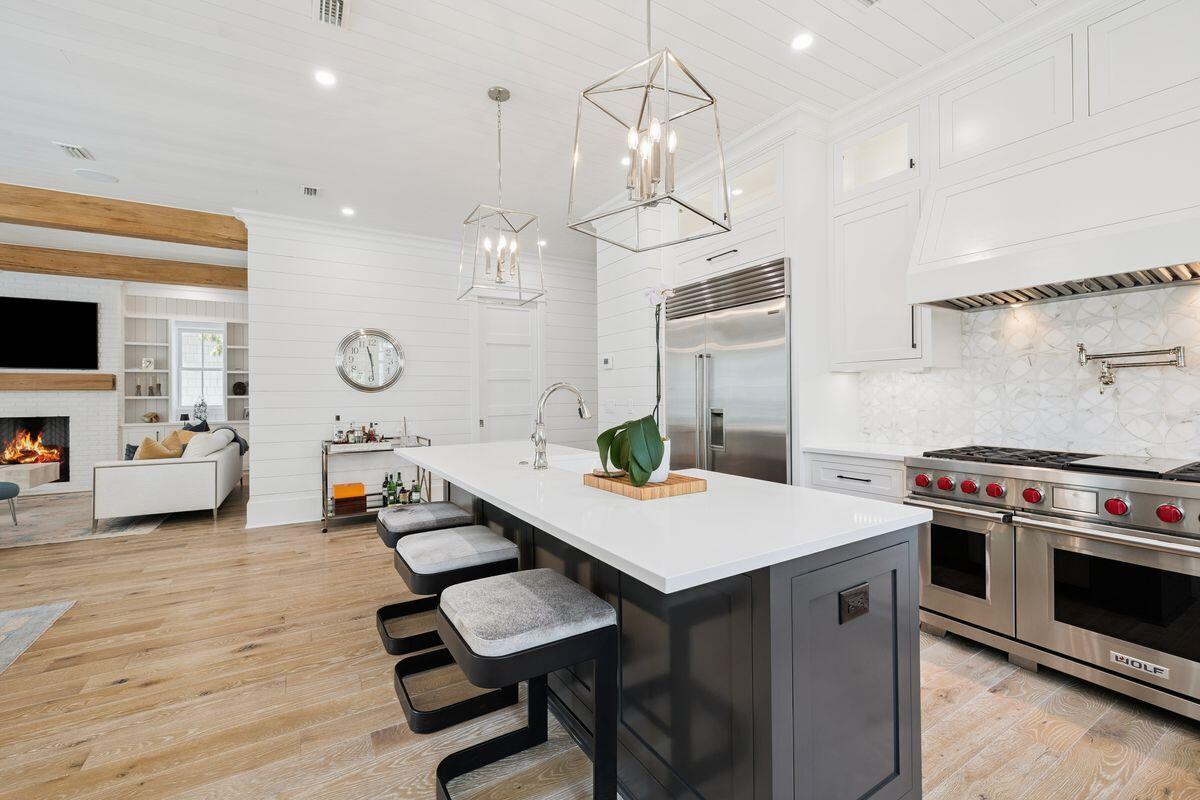 41 North Shingle Lane Watersound, FL 32461 - Photo 5 of 48 an open kitchen with a table and chairs in it