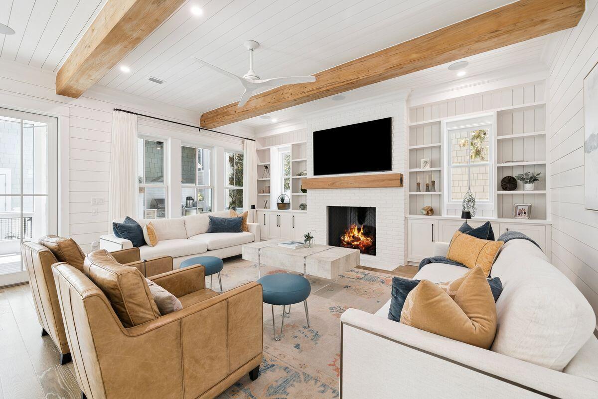 41 North Shingle Lane Watersound, FL 32461 - Photo 6 of 48 a living room with furniture fireplace and a flat screen tv