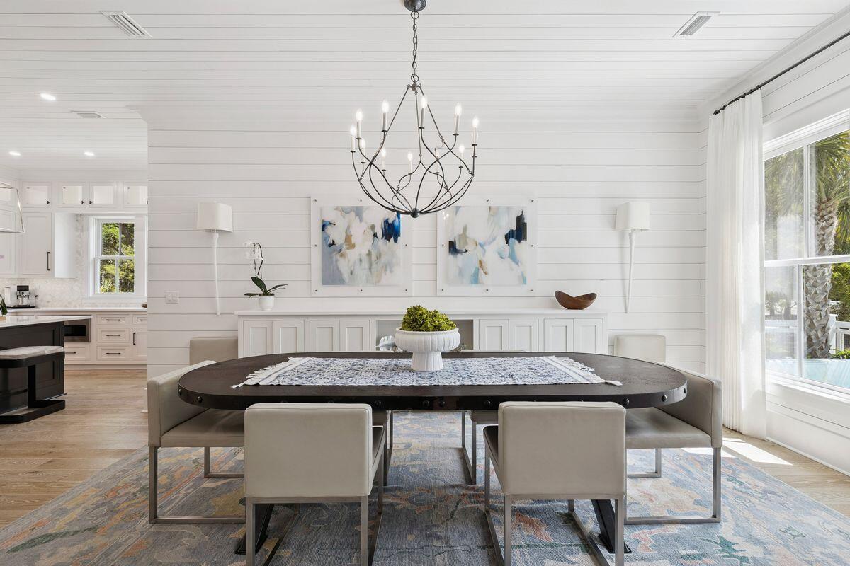 41 North Shingle Lane Watersound, FL 32461 - Photo 8 of 48 a view of a dining room with furniture and wooden floor
