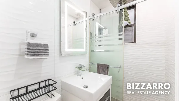 a bathroom with a sink and a shower