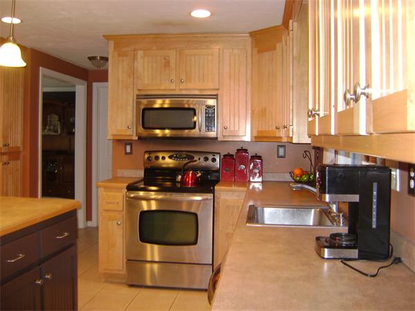 269 Hillcrest Road Northbridge, MA 01588 - Photo 2 of 16 a kitchen with a stove a microwave and refrigerator