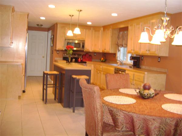 269 Hillcrest Road Northbridge, MA 01588 - Photo 3 of 16 a large kitchen with a table and chairs