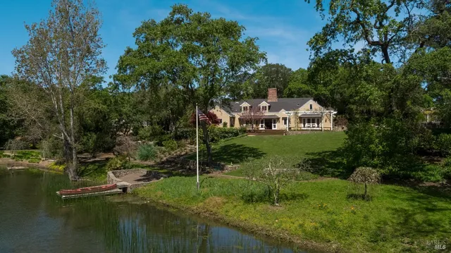 a view of a lush green hillside and houses