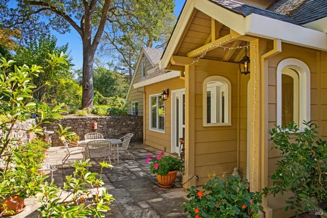 a view of a patio with a table chairs and a table