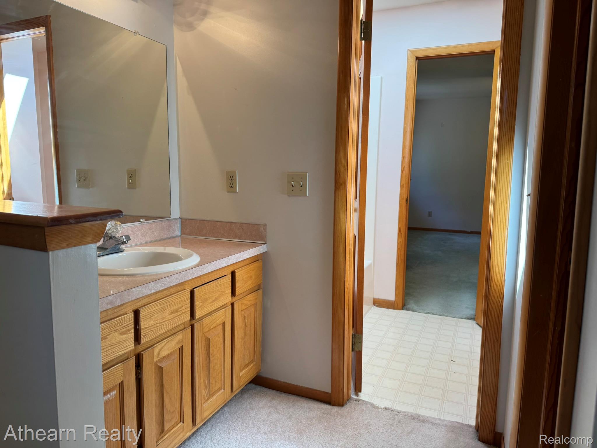 11449 Torrey Road Fenton, MI 48430 - Photo 25 of 30 Vanity with an integrated sink and laminate countertop