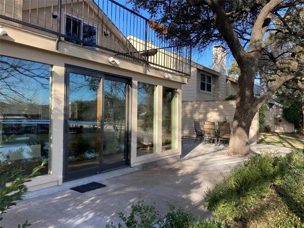 a view of a building with door and outdoor space