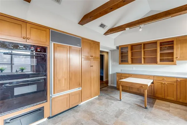 a room with furniture and large window