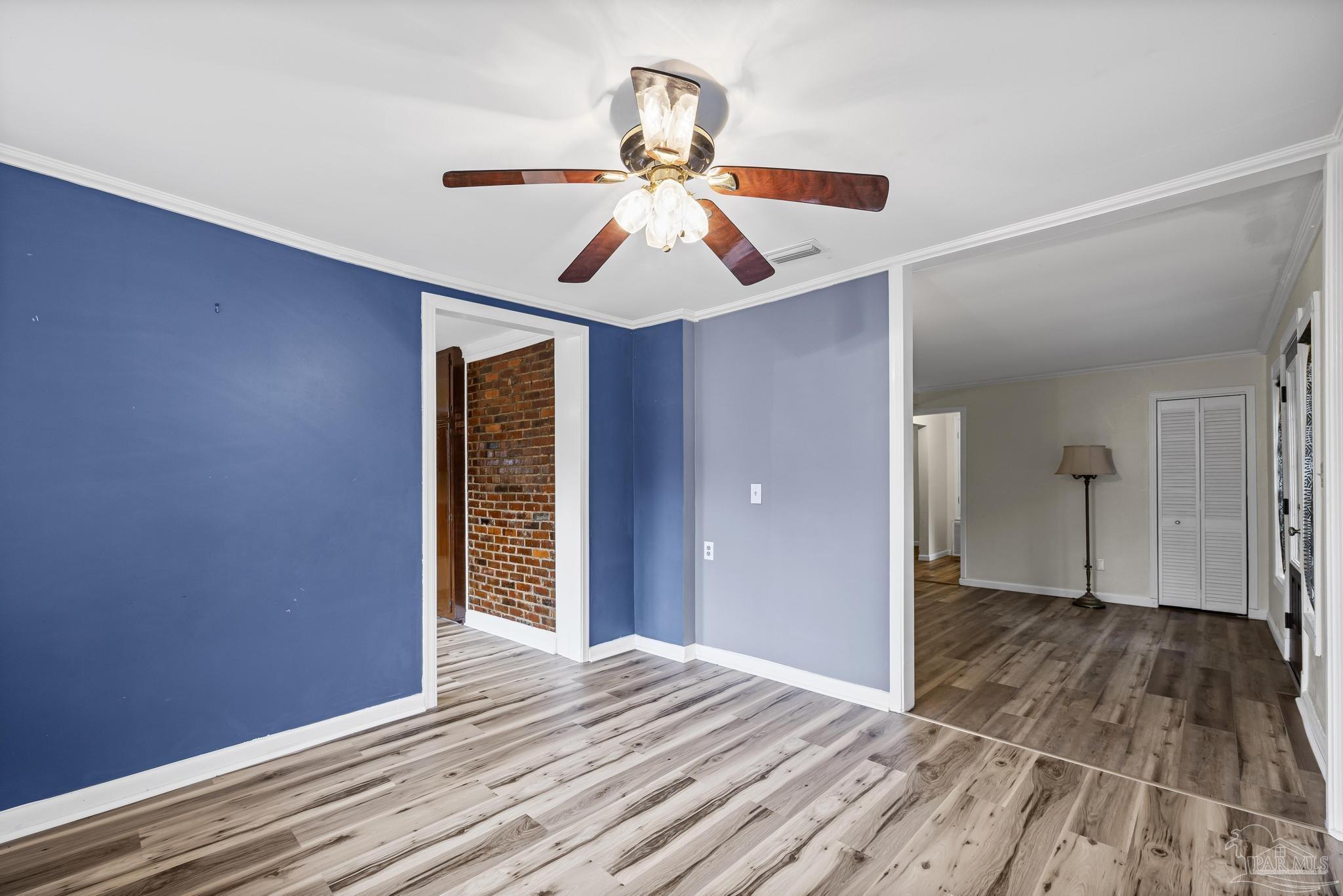 3811 Wilkes Street Pace, FL 32571 - Photo 24 of 59 a view of empty room with wooden floor