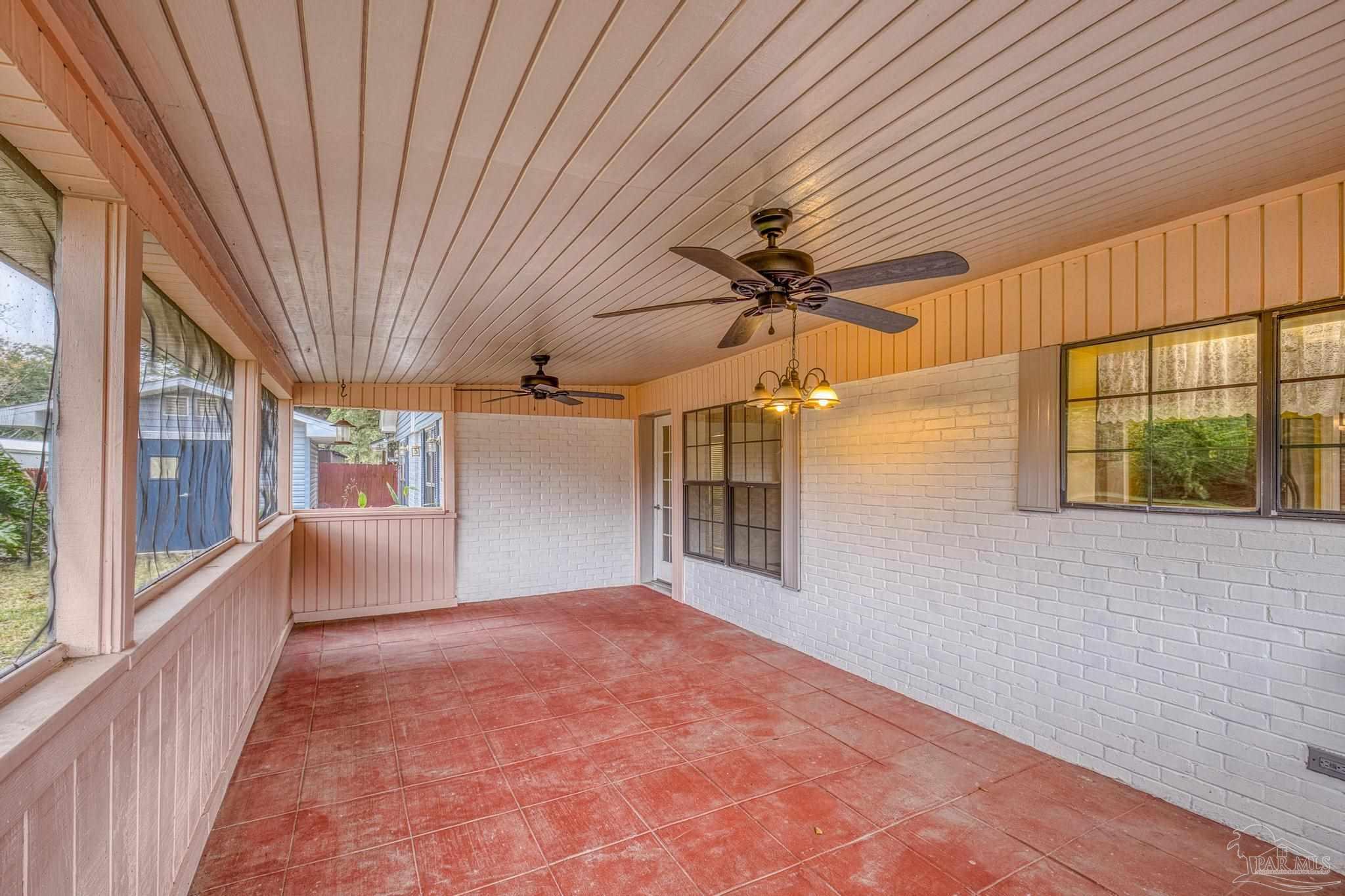 3811 Wilkes Street Pace, FL 32571 - Photo 39 of 59 a view of a livingroom with a ceiling fan and window