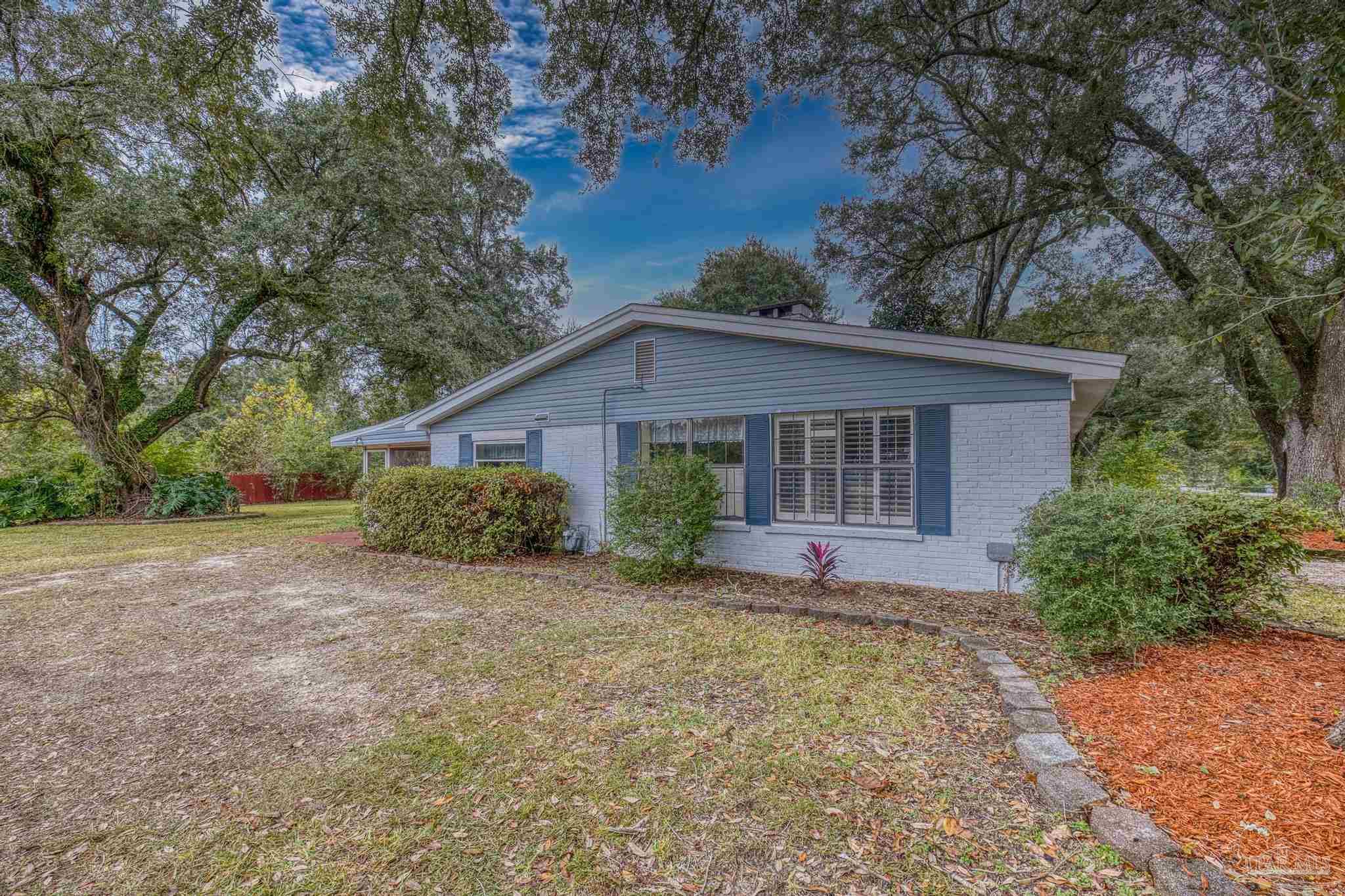 3811 Wilkes Street Pace, FL 32571 - Photo 48 of 59 front view of a house with a yard