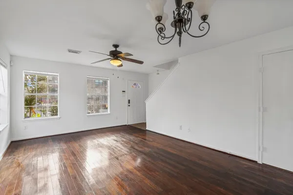 a view of an empty room with windows