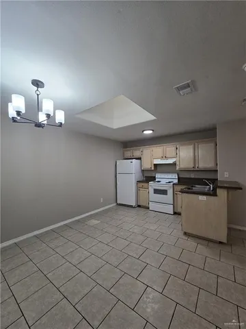 a view of a kitchen with a sink